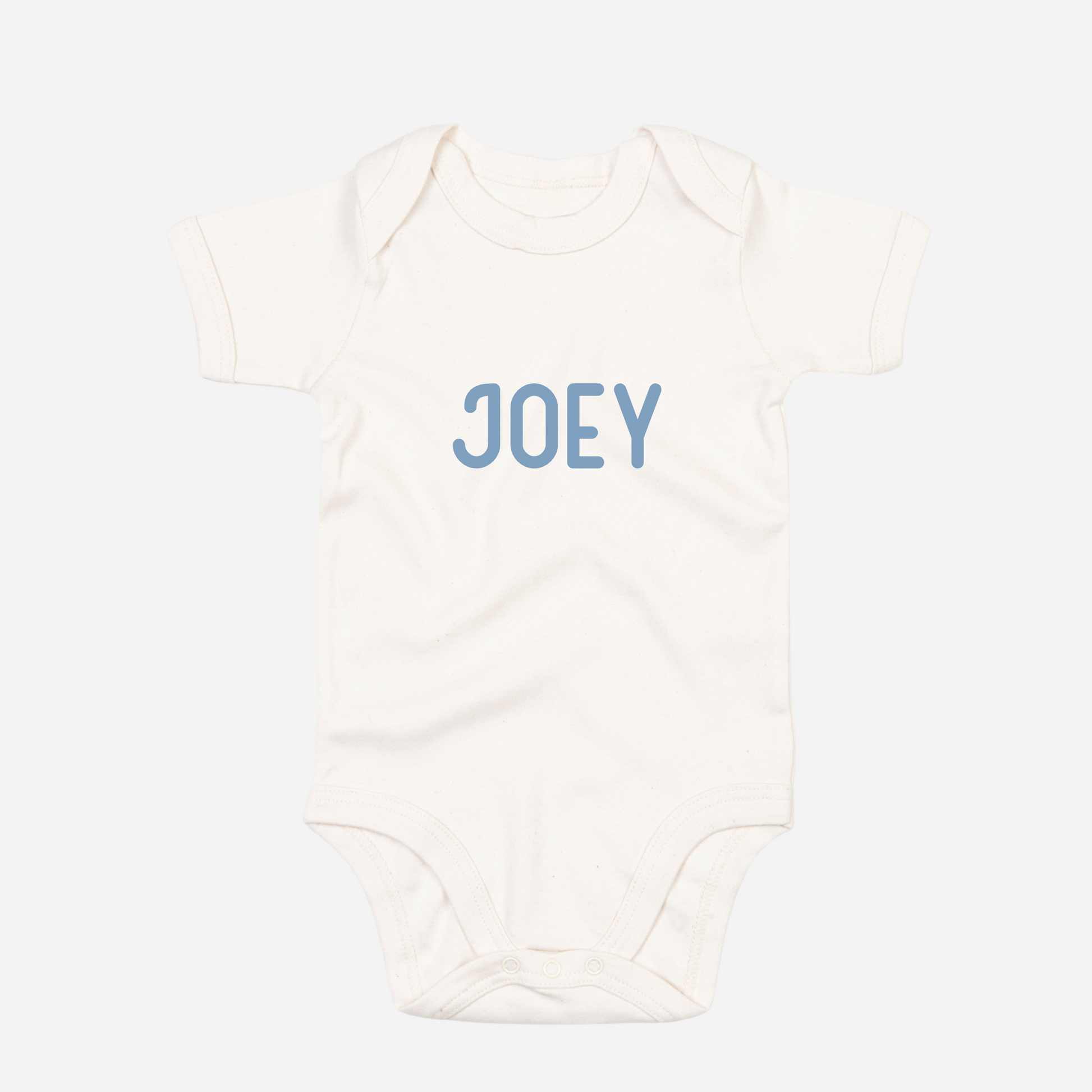 Personalised organic baby bodysuit in organic natural with custom text